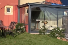 Gîte Colmar Vue dans la véranda depuis le jardin